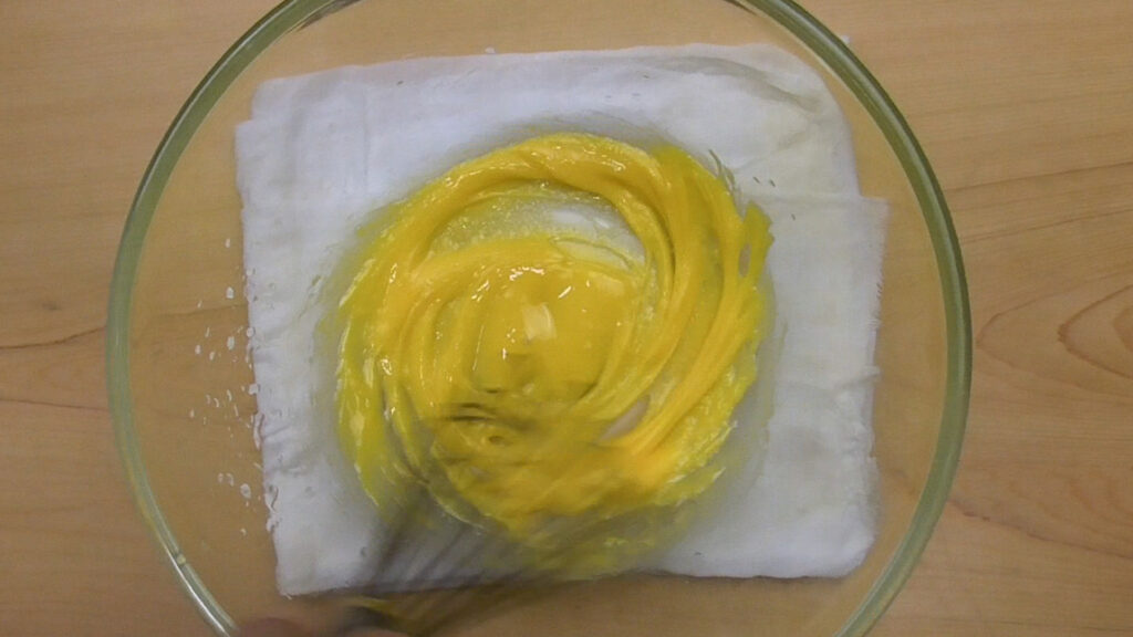 Mix egg yolk and oil