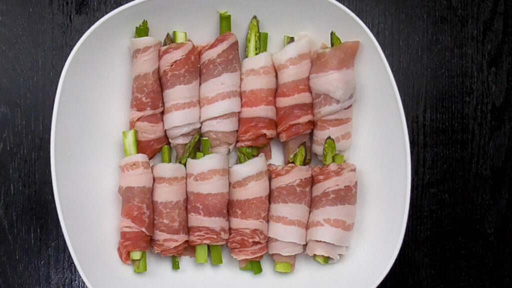 Wrap asparagus with pork