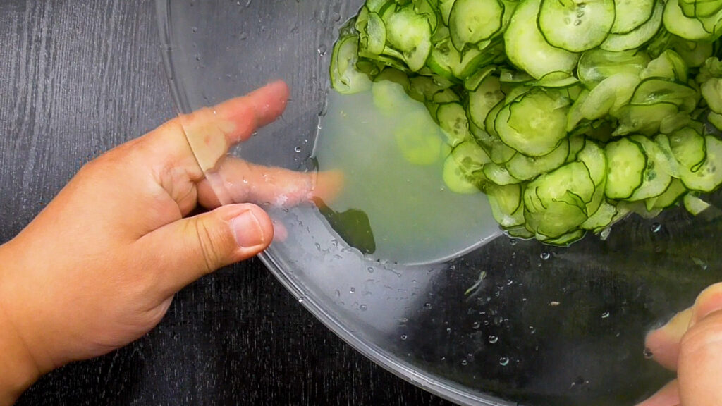 Water comes out of the cucumber.